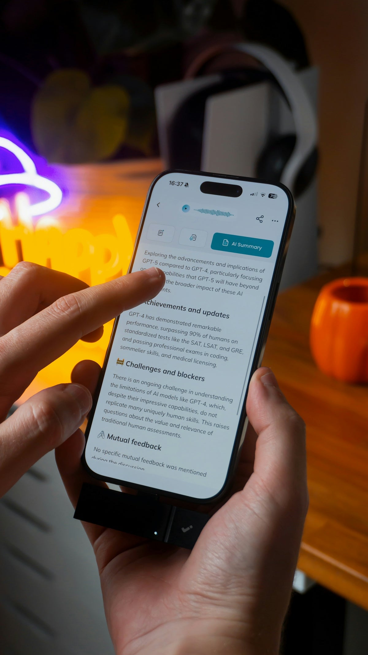 Hands scrolling through article on smartphone screen of a smartphone